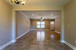 Pike Rd townhouse for rent - an empty living room with a chandelier