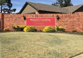 Oklahoma City townhouse for rent - a red brick building with a sign for masons landing