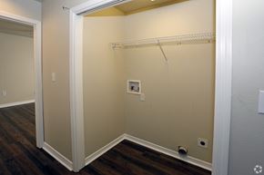 Foley apartment for rent - A small closet with a white door and a white shelf.
