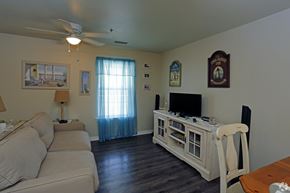 Foley apartment for rent - A living room with a couch, chair, and television.