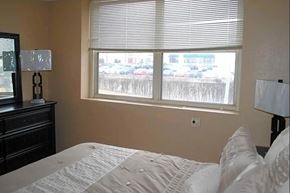Little Rock apartment for rent - a bedroom with a large window and a bed