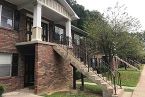 Canton apartment for rent - an old brick building with stairs and a porch