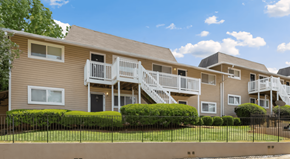 Stone Mountain apartment for rent - the view of an apartment building with stairs and a fence