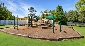 Stone Mountain apartment for rent - a playground with a swing set in a park