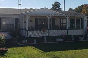 Acworth apartment for rent - a house with a porch and a lawn