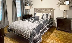 Alexander apartment for rent - a bedroom with a bed and two night stands
