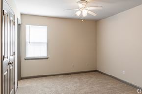 Augusta apartment for rent - A room with a ceiling fan and a window.