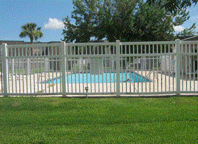 Sulphur apartment for rent - a white picket fence in front of a swimming pool