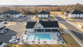 Bentonville apartment for rent - an aerial view of a building with a swimming pool