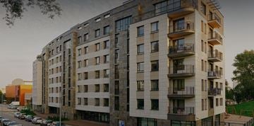 Jackson apartment for rent - A large building with many windows and balconies.