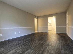 Covington apartment for rent - an empty living room with wood floors and white walls