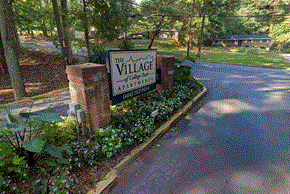 College Park apartment for rent - a view of the village sign from the street