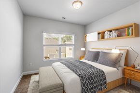 Savannah apartment for rent - a bedroom with a large bed and a bench at the end of the bed