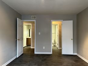 College Park apartment for rent - a living room with a door open to a hallway and a bathroom