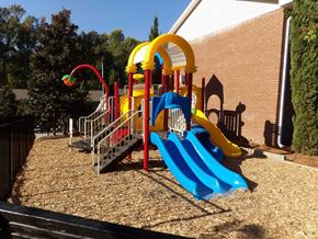 Augusta townhouse for rent - a playground at a school with a blue slide