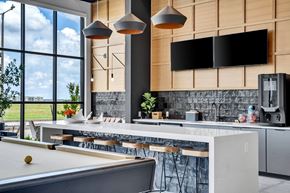 Oklahoma City apartment for rent - a kitchen with a large window and a table with chairs