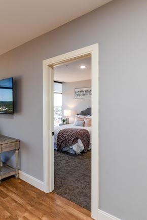 Manchester apartment for rent - a bedroom with a bed and a tv in a 555 waverly unit