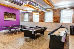 Allenstown apartment for rent - a game room with two pool tables and a ping pong table