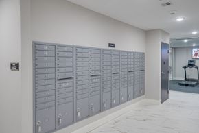 Manchester apartment for rent - a lockers in a room with a marble floor