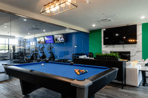 Concord apartment for rent - A pool table is in the middle of a room with a blue wall.