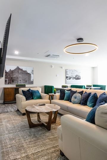 Manchester apartment for rent - A living room with a white couch and a coffee table.
