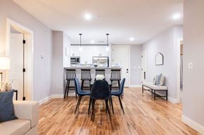 Manchester apartment for rent - A dining room with a table set for six.
