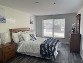 Concord apartment for rent - a bedroom with a large bed and a window