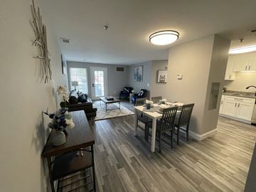 Concord apartment for rent - an open living room and dining room with a table and chairs