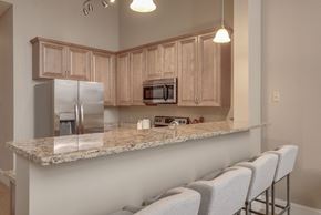Manchester apartment for rent - a kitchen with a granite counter top and stainless steel appliances