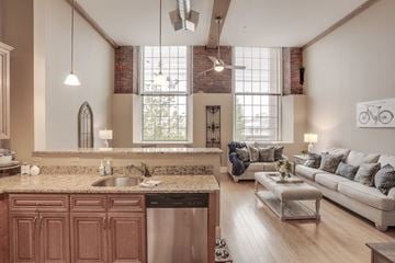 Manchester apartment for rent - a living room with a kitchen and a couch and a table