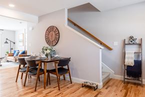 Laconia apartment for rent - A dining room with a wooden table and chairs.