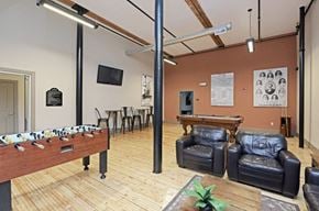 Clinton apartment for rent - a game room with a pool table and leather furniture