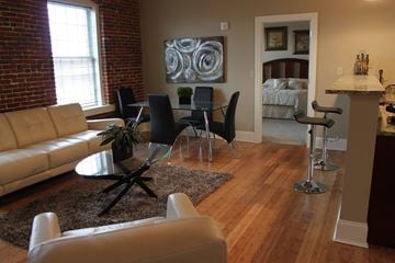 Manchester apartment for rent - a living room and dining room with a couch and a table