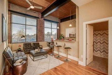Keene apartment for rent - a living room with a couch and a bar