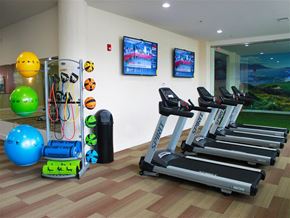 Nashua apartment for rent - A gym with treadmills, exercise balls, and other equipment.