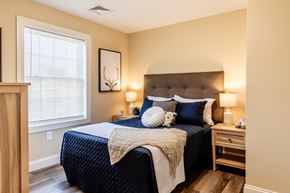 Laconia apartment for rent - a bedroom with a large bed and a window