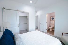 Richland apartment for rent - a bedroom with a bed and a bathroom with a toilet