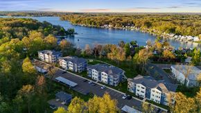Richland apartment for rent - A bird's eye view of a residential area with a river in the background.