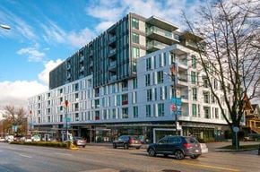 Vancouver condo for rent - A modern multi-story building with a white facade and blue accents.