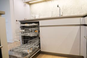 Vancouver condo for rent - A dishwasher with the door open is in a kitchen.