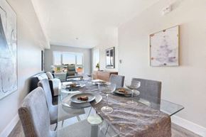 Vancouver apartment for rent - a dining room with a glass table and chairs
