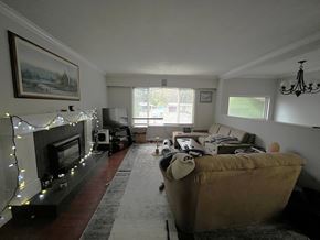 Maple Ridge apartment for rent - A living room with a fireplace and a couch.
