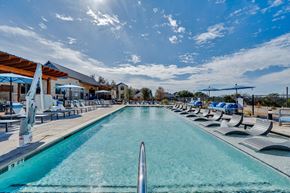 Marble Falls apartment for rent - A long rectangular pool with a metal ladder on the side.