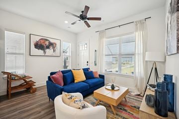 Celina apartment for rent - A living room with a blue couch and a wooden coffee table.