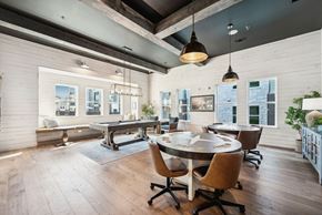 Denton apartment for rent - A modern dining room with a large table and chairs.