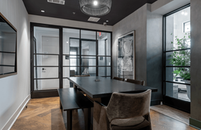 Round Rock apartment for rent - A modern dining room with a large table and chairs.