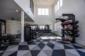 Antioch apartment for rent - A black and white checkered floor in a gym with TRX and other exercise equipment.