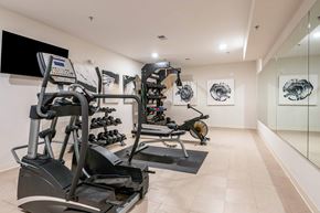 Asheville apartment for rent - A gym with treadmills, elliptical machines, and exercise bikes.