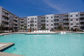 Chester apartment for rent - A large swimming pool in front of apartment buildings.