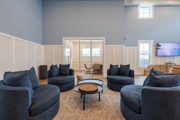 Melbourne apartment for rent - A living room with grey couches and a coffee table.